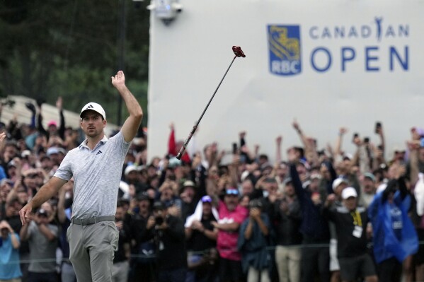 FILE - Nick Taylor, of Canada, reacts after winning the Canadian Open golf tournament on the fourth playoff hole against Tommy Fleetwood, of the United Kingdom, in Toronto, Sunday, June 11, 2023. Taylor's epic eagle putt to win the Canadian Open is now part of the tournament's logo for 2024. (Nathan Denette/The Canadian Press via AP, File)