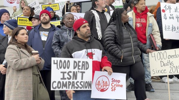 Demostrators gather at a rally at City Hall to support legislation that gives the mayors extra power to address the city's fentanyl crisis Wednesday, Jan. 29, 2025, in San Francisco. (AP Photo/Terry Chea)