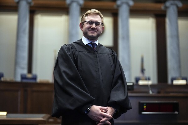 FILE - Supreme Court Justice Andrew Pinson poses, April 17, 2024, in Atlanta. Voters are deciding the race between Pinson and Democratic former congressman John Barrow in a nonpartisan general election on Tuesday, May 21, 2024. (AP Photo/Mike Stewart, File)