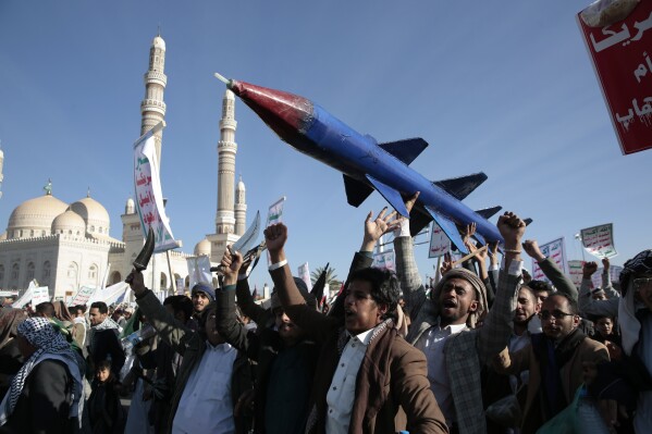 Houthi supporters attend a rally in support of the Palestinians in the Gaza Strip and against the U.S.-led airstrikes on Yemen, in Sanaa, Yemen, Friday, Jan. 26, 2024. (APPhoto/Osamah Abdulrahman)