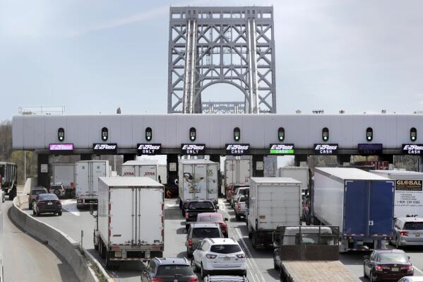 FILE - Traffic passes through the toll plaza at the George Washington Bridge on April 17, 2019, in Fort Lee, N.J. The busy bridge connecting New Jersey and New York City is moving to cashless tolls on July 10, 2022, and in the process removing a reminder of a notorious piece of history. (AP Photo/Julio Cortez, File)