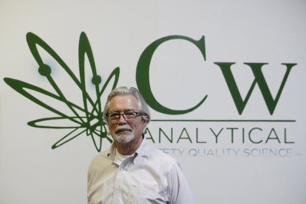 In this Friday, Aug. 16, 2019, photo, Robert Martin, co-founder and CEO of CW Analytical Laboratories, poses for photos while being interviewed at his office in Oakland, Calif. Chemists are trying to solve a scientific mystery involving marijuana brownies. Chocolate seems to throw off test results for potency. That could be dangerous for consumers looking to relax, not hallucinate. (AP Photo/Jeff Chiu)