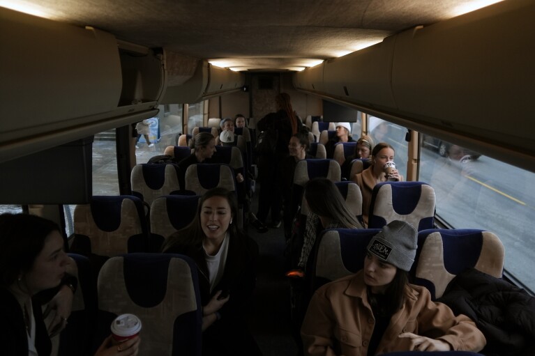 The Professional Women's Hockey League New York team rides a bus from their hotel to the rink for the inaugural PWHL game in Toronto, Monday, Jan. 1, 2024.(AP Photo/Brittany Peterson)