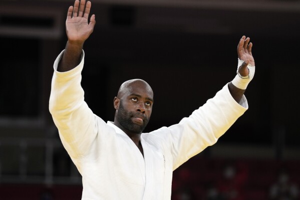 FILE - Teddy Riner of France reacts after defeating Hisayoshi Harasawa of Japan, not shown, in their men's +100kg bronze medal judo match at the 2020 Summer Olympics, Friday, July 30, 2021, in Tokyo, Japan. The world's most famous active judoka attempts to cap his incredible career with a record-tying third individual Olympic gold medal in front of his home fans. Now 35, Riner took a shocking quarterfinal loss in Tokyo, but the 11-time world champion heavyweight still won gold in the mixed team event. (AP Photo/Vincent Thian, File)