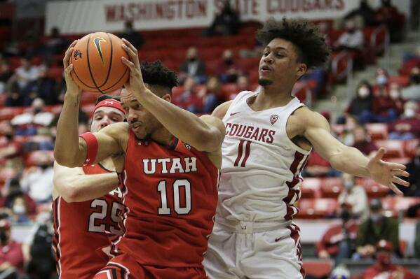 FILE - Utah guard Marco Anthony (10) grabs a rebound in front of Washington State forward DJ Rodman (11) during the second half of an NCAA college basketball game, Wednesday, Jan. 26, 2022, in Pullman, Wash. Experience will be an asset aiding the Utes’ efforts to climb the Pac-12 ladder. Anthony was the top rebounder (7.2 per game) last season. (AP Photo/Young Kwak, File)