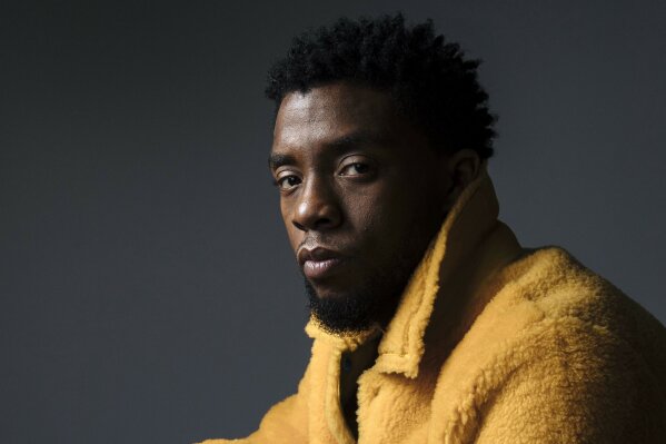 FILE - In this Feb. 14, 2018 photo, actor Chadwick Boseman poses for a portrait in New York to promote his film, "Black Panther."  Boseman, who played Black icons Jackie Robinson and James Brown before finding fame as the regal Black Panther in the Marvel cinematic universe, has died of cancer. His representative says Boseman died Friday, Aug. 28, 2020 in Los Angeles after a four-year battle with colon cancer. He was 43. (Photo by Victoria Will/Invision/AP)