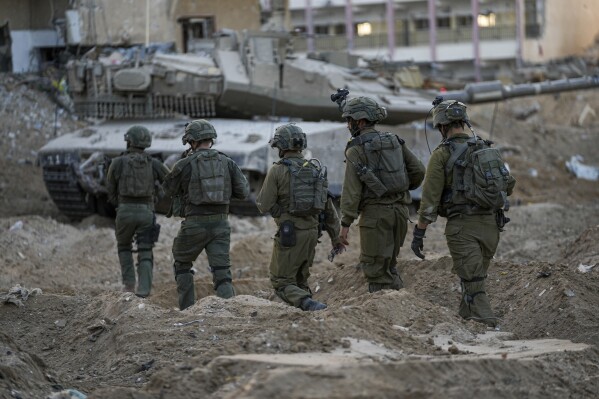 Israeli soldiers are seen during a ground operation in the Gaza Strip, Wednesday, Nov. 8, 2023. Prime Minister Benjamin Netanyahu did not elaborate this week when he said that Israel would maintain indefinite 