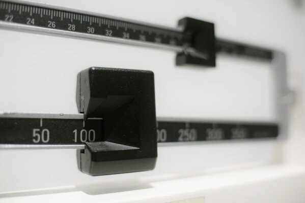 
              FILE - This April 3, 2018 file photo shows a closeup of a beam scale in New York. A new government report released on Thursday, Dec. 20, 2018, shows that while adult waistlines have been expanding, the average height of U.S. men actually fell slightly over the past decade. The height of women stayed the same. (AP Photo/Patrick Sison, File)
            