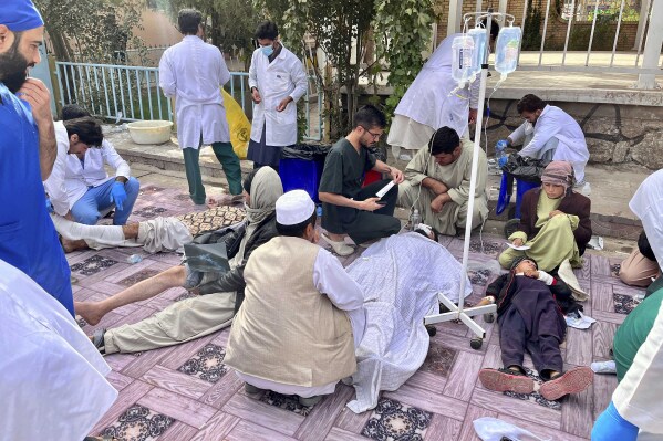 In this handout photo released by MSF Afghanistan, injured people received treatment after a powerful earthquake in Herat province, western of Afghanistan, Sunday, Oct. 15, 2023. (MSF Afghanistan via AP)