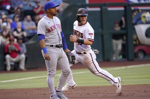 Arizona Diamondbacks' Eduardo Escobar watches his RBI single