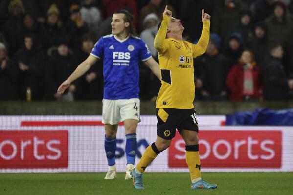 Wolverhampton Wanderers' Daniel Podence, right, celebrates after scoring during the English Premier League soccer match between Wolverhampton Wanderers and Leicester City at Molineux stadium in Wolverhampton, England, Sunday, Feb. 20, 2022. (AP Photo/Rui Vieira)