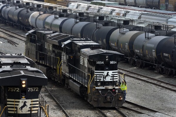 FILE - Norfolk Southern locomotives are moved through the Conway Terminal in Conway, Pa., Saturday, June 17, 2023. Norfolk Southern said Friday, Sept. 1, it believes a software defect — not a hacker — was the cause of the widespread computer outage that forced the railroad to park all of its trains for most of Monday.(AP Photo/Gene J. Puskar, File)