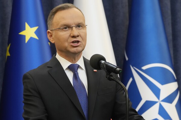 FILE - Poland's President Andrzej Duda gives a statement to the media in Warsaw, Poland, Wednesday Jan. 10, 2024, after the arrest of two politicians convicted of abuse of power who had taken refuge for hours in the presidential palace. Poland’s president is calling on other other members of the NATO alliance to raise their spending on defense to 3% of their GDP as Russia puts its economy on a war footing and pushes forward with its invasion of Ukraine. Duda made his call both in remarks in Warsaw and in a piece published by the Washington Post. (AP Photo/Czarek Sokolowski, File)