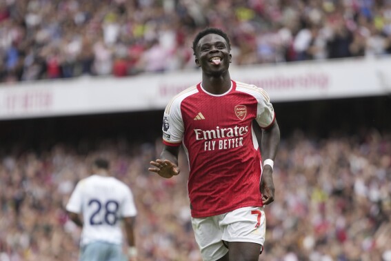 Arsenal's Bukayo Saka celebrates after scoring during the English Premier League soccer match between Arsenal and Nottingham Forest at Emirates stadium in London, Saturday, Aug. 12, 2023. (AP Photo/Kirsty Wigglesworth)