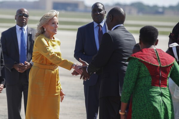 First lady Jill Biden, center, greets Kenya's President William Ruto and first lady Rachel Ruto, at right in green, as they arrive at Andrews Air Force Base, Md., Wednesday, May 22, 2024, for a state visit to the United States. (AP Photo/Luis M. Alvarez)