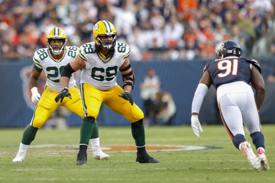 FILE - Green Bay Packers offensive tackle David Bakhtiari (69) blocks against Chicago Bears defensive end Yannick Ngakoue (91) during an NFL football game Sept. 10, 2023, in Chicago. Bakhtiari was hoping he had gotten past the knee issues that required him to undergo three separate surgeries and impacted his last two seasons. Now the oldest player on the NFL’s youngest team realizes that’s not the case. (AP Photo/Kamil Krzaczynski, File)