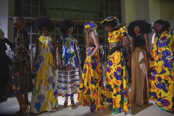 Models get ready backstage for South African designer Gavin Rajah's show during Johannesburg Fashion Week 2023 in Johannesburg, South Africa, Thursday, Nov. 9, 2023. (AP Photo/Jerome Delay)