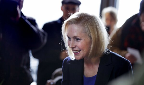 
              Sen. Kirsten Gillibrand, D-NY, smiles as she listens to a patron while visiting a coffee shop on Main Street in Concord, N.H., Friday, Feb. 15, 2019. Gillibrand visited New Hampshire as she explores a 2020 run for president. (AP Photo/Charles Krupa)
            