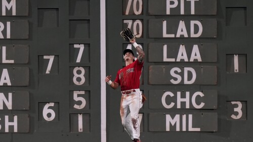 Boston Red Sox's Jarren Duran catches a fly ball by Texas Rangers' Travis Jankowski in the seventh inning of a baseball game, Wednesday, July 5, 2023, in Boston. (AP Photo/Steven Senne)