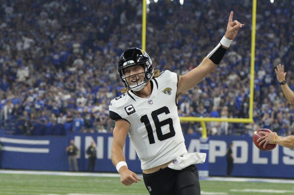 Jacksonville Jaguars quarterback Trevor Lawrence celebrates after throwing a touchdown pass to wide receiver Calvin Ridley during the first half of an NFL football game against the Indianapolis Colts Sunday, Sept. 10, 2023, in Indianapolis. (AP Photo/Jeff Dean)