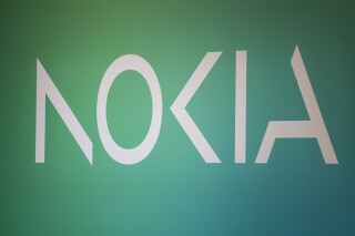 FILE - Nokia logo seen in the Mobile World Congress 2023 in Barcelona, Spain, Tuesday, Feb. 28, 2023. Nokia on Thursday reported a double-digit decline in sales and a fall in profit in the last three months of 2023, with the wireless and fixed-network equipment maker saying operators are cutting back on investments into 5G and other technology because of economic uncertainty. (AP Photo/Joan Mateu Parra, File)
