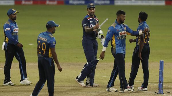 India's captain Shikhar Dhawan walks off the pitch after defeating Sri Lanka by seven wickets in their first one day international cricket match in Colombo, Sri Lanka, Sunday, July 18, 2021. (AP Photo/Eranga Jayawardena)