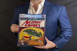 This photo provided by Metropolis Collectibles on Tuesday, April 6, 2021, shows Vincent Zurzolo, co-owner of ComicConnect, holding Action Comics first edition 1938 comic book marking Superman's first appearance, which has sold for an historic, record-breaking $3,250,000. (Courtesy of Metropolis Collectibles via AP)