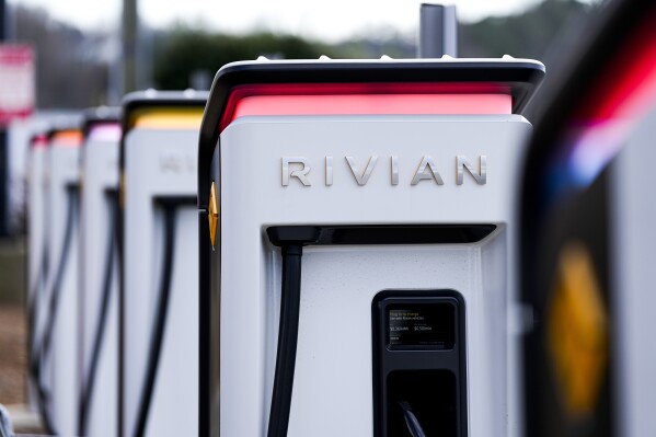 Rivian chargers sit Monday, March 4, 2024, in Charlotte, N.C. In campaigns for Congress and for governor around the country, candidates are talking about how green the grid should be. (AP Photo/Chris Carlson)