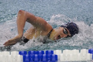 Pennsylvania's Lia Thomas competes in the 200 freestyle final at the NCAA swimming and diving championships Friday, March 18, 2022, at Georgia Tech in Atlanta. The NCAA is not taking medals away from Thomas, a transgender athlete, despite online claims. (AP Photo/John Bazemore)