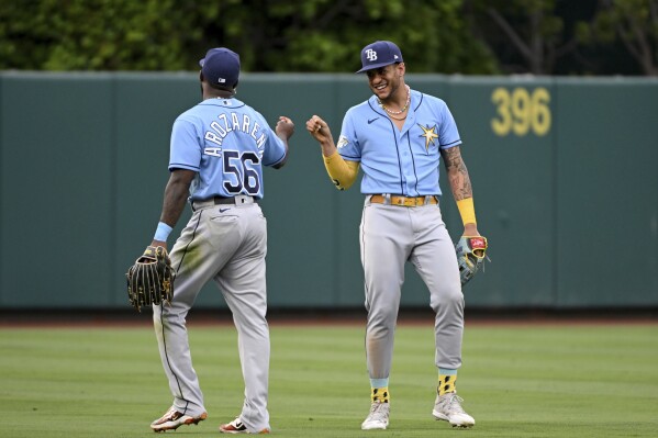 ST. PETERSBURG, FL - MAY 18: Tampa Bay Rays infielder Isaac Paredes (17)  throws the ball over to first base during the MLB regular season game  between the Detroit Tigers and the