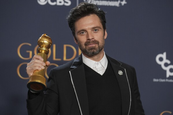 Sebastian Stan poses in the press room with the award for best performance by a male actor in a motion picture - musical or comedy for "A Different Man" during the 82nd Golden Globes on Sunday, Jan. 5, 2025, at the Beverly Hilton in Beverly Hills, Calif. (AP Photo/Chris Pizzello)