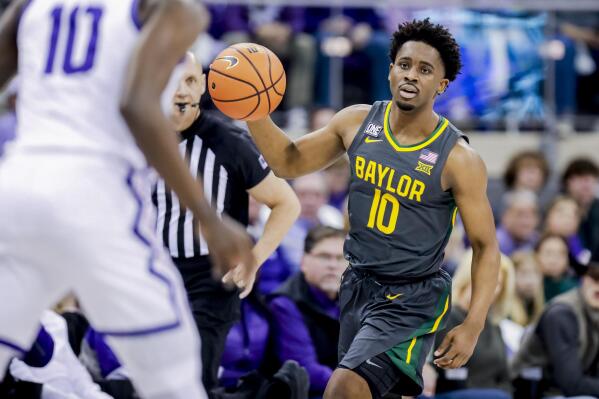 Baylor guard Adam Flagler (10) looks down court during the first half of an NCAA college basketball game against TCU in Fort Worth, Texas, Saturday, Feb. 11, 2023. (AP Photo/Gareth Patterson)