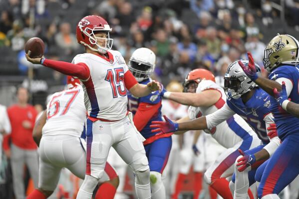 FILE - AFC quarterback Patrick Mahomes (15), of the Kansas City Chiefs passes against the NFC during the first half of the Pro Bowl NFL football game, Sunday, Feb. 6, 2022, in Las Vegas.  The NFL is replacing the Pro Bowl with weeklong skills competitions and a flag football game. The new event will be renamed “The Pro Bowl Games” and will feature AFC and NFC players showcasing their football and non-football skills in challenges over several days.   (AP Photo/David Becker, File )