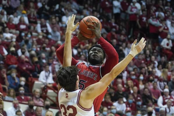 St. John's Dylan Addae-Wusu (5) shoots over Indiana's Trey Galloway (32) during the first half of an NCAA college basketball game, Wednesday, Nov. 17, 2021, in Bloomington, Ind. (AP Photo/Darron Cummings)