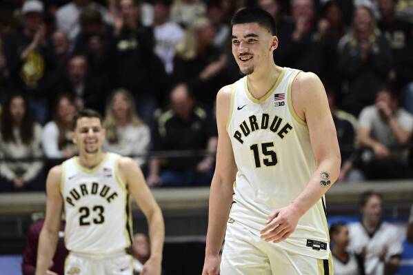 Purdue center Zach Edey (15) smiles while walking toward the bench during the second half of the team's NCAA college basketball game against Eastern Kentucky, Friday, Dec. 29, 2023, in West Lafayette, Ind. (AP Photo/Marc Lebryk)