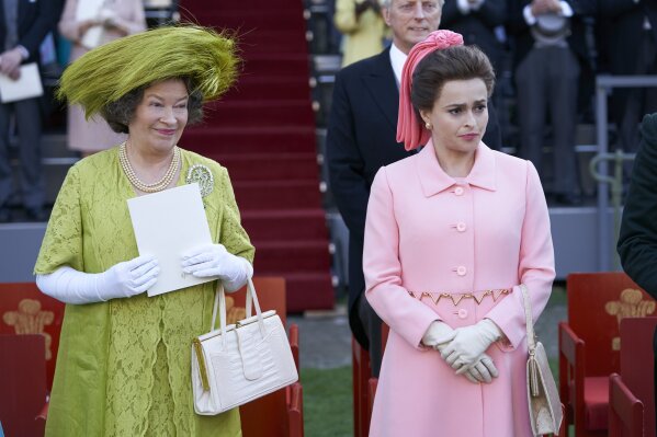 In this image released by Netflix, Marion Bailey portrays Queen Elizabeth the Queen Mother, left, and Helena Bonham Carter portrays Princess Margaret in a scene from the third season of "The Crown,"  debuting Sunday on Netflix. (Des Willie/Netflix via AP)