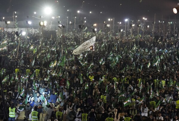 Supporters of the Pakistani religious group Tehreek-e-Labbaik Pakistan (TLP) attend an election campaign rally in Karachi, Pakistan, Sunday, Feb. 4, 2024. (AP Photo/Fareed Khan)