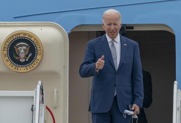 President Joe Biden gestures as he boards Air Force One at Andrews Air Force Base, Md., Tuesday, June 14, 2022. Biden is traveling to Philadelphia to speak at the AFL-CIO convention on how he's trying to make the economy work for working-class Americans. (AP Photo/Gemunu Amarasinghe)