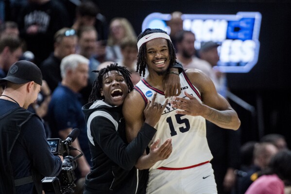 Dayton forward DaRon Holmes II (15) celebrates his team's victory over Nevada after a first-round college basketball game in the NCAA Tournament in Salt Lake City, Thursday, March 21, 2024 (AP Photo/Isaac Hale)