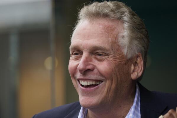 Democratic gubernatorial candidate, former Gov. Terry McAuliffe, greets supporters during a tour of downtown Petersburg, Va., Saturday, May 29, 2021. McAuliffe faces four other Democrats in the a primary June 8. (AP Photo/Steve Helber)