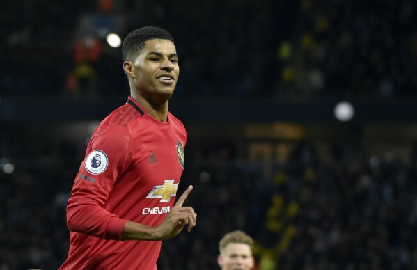 FILE - In this Saturday, Dec. 7, 2019 file photo, Manchester United's Marcus Rashford during their English Premier League soccer match against Manchester City at Etihad stadium in Manchester, England. Paul Pogba and Marcus Rashford are expected to be available for Manchester United whenever the Premier League is allowed to resume after its suspension because of the coronavirus outbreak. Rashford is United’s top scorer and Pogba is the club’s most high-profile player. They were both sidelined with long-term injuries at the time play was halted in England.  (AP Photo/Rui Vieira, file)