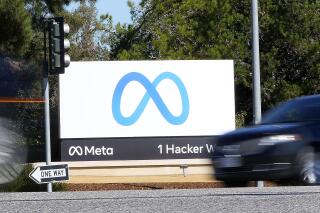 FILE - Facebook unveiled their new Meta sign at the company headquarters in Menlo Park, Calif., on Oct. 28, 2021. Shares of the company formerly known as Facebook saw a historic plunge Thursday after the social media giant reported a rare profit decline due to a sharp rise in expenses, shaky ad revenue growth and fewer daily U.S. users on its flagship platform. (AP Photo/Tony Avelar, File)