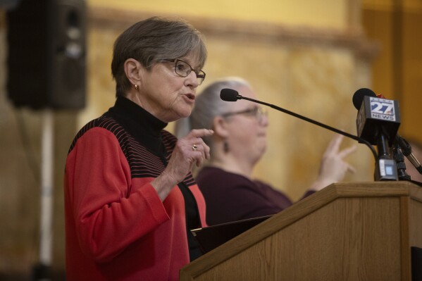 FILE - Kansas Gov. Laura Kelly speaks about the necessity to expand medicaid in Kansas during a rally, March 6, 2024, in Topeka, Kan. Kansas will increase what have been among the lowest benefits in the U.S. for workers who are injured or killed on the job under bipartisan legislation that Kelly signed into law Thursday, April 11. (Evert Nelson/The Topeka Capital-Journal via AP, File)