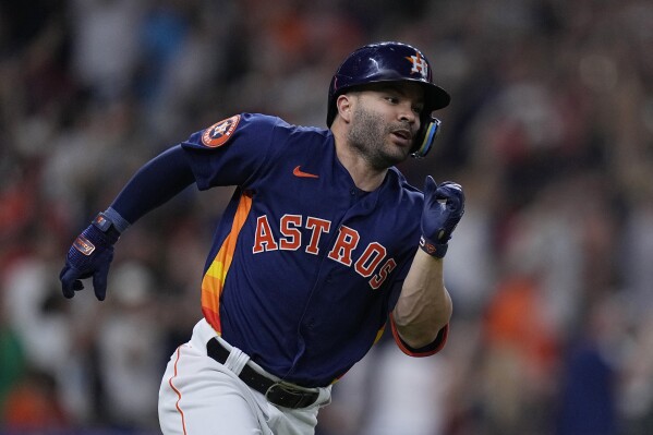 FILE - Houston Astros' José Altuve runs after his 2,000th career hit, a single off Seattle Mariners starting pitcher Logan Gilbert, during the fifth inning of a baseball game Aug. 19, 2023, in Houston. Altuve and the Astros agreed to a $125 million, five-year contract that covers 2025-29. Houston announced a new multiyear deal Tuesday, Feb. 6, 2024, without disclosing details. (AP Photo/Kevin M. Cox, File)
