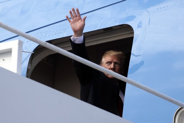 
              President Donald Trump boards Air Force One, Sunday, March 24, 2019, at Palm Beach International Airport, in West Palm Beach, Fla., en route to Washington. (AP Photo/Carolyn Kaster)
            