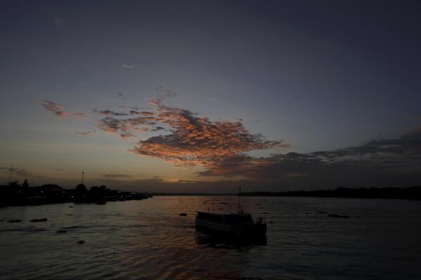 FILE - A passenger boat departs from the port city of Breves, located on the island of Marajo, Para state, on the mouth of the Amazon river, Brazil, Thursday, Dec. 3, 2020. Brazil’s environmental regulator refused on Wednesday, MAy 17, 2023, to grant a license for a controversial offshore oil drilling project near the mouth of the Amazon River, prompting celebration from environmentalists who had warned of its potential impact. (AP Photo/Eraldo Peres, File)