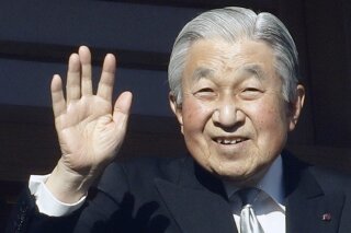 FILE - In this Jan. 2, 2019, file photo, Japan's Emperor Akihito waves to well-wishers from the bullet-proofed balcony during his New Year's public appearance with his family members at Imperial Palace in Tokyo. Japan's Imperial Palace says 86-year-old former Emperor Akihito fainted at his residence but regained his strength after a good night's sleep. (AP Photo/Eugene Hoshiko)