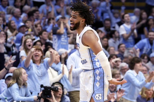 North Carolina guard RJ Davis (4) celebrates after hitting a 3-pointer against Notre Dame during the second half of an NCAA college basketball game Tuesday, March. 5, 2024, in Chapel Hill, N.C. (AP Photo/Chris Seward)