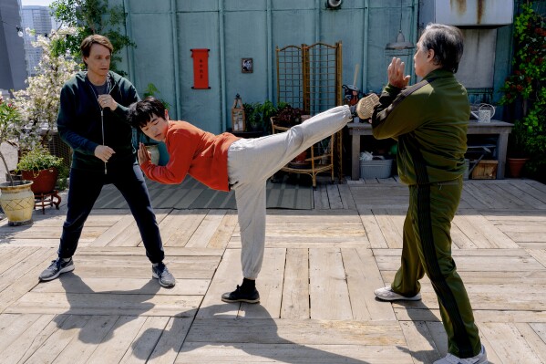 This image released by Sony Pictures shows, from left, Ralph Macchio, Ben Wang and Jackie Chan in a scene from "Karate Kid: Legends." (Jonathan Wenk/Sony Pictures via AP)