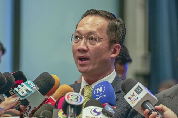 United Thai Nation Party spokesperson Akaradej Wongpitakroj talks to reporters during a press conference at the United Thai Nation Party Headquarters in Bangkok, Thailand, Thursday, Aug. 17, 2023. A pro-military party affiliated with the outgoing prime minister Prayuth Chan-ocha said Thursday it has agreed to join a coalition led by the populist Pheu Thai Party to form Thailand's next government. (AP Photo/Sakchai Lalit)